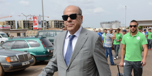 President of the Algerian Football Federation Mohamed Raouraoua arrives at Ouagadougou Airport in Burkina Faso on October 10, 2013, ahead of the 2014 World Cup qualifying football match between Burkina Faso and Algeria on October 12. AFP PHOTO / FAROUK BATICHE (Photo credit should read FAROUK BATICHE/AFP/Getty Images)