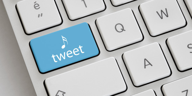 Blue coloured 'Tweet' button on a keyboard.