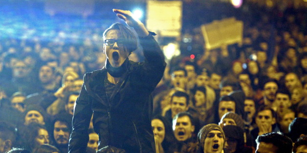 A demonstrator shouts anti corruption slogans during a street protest in Bucharest, Romania November 4, 2015. Romanian Prime Minister Victor Ponta quit on Wednesday in a surprise move that will probably produce a new cabinet led by a technocrat, after street protesters demanded resignations over a deadly fire in a Bucharest nightclub. An estimated 15,000 people marched in Bucharest on Wednesday evening, and thousands more poured onto the streets of cities across Romania, saying the government's