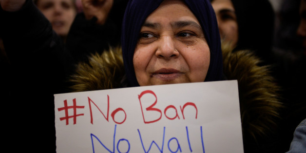 A Muslim women holds a sign during anti-Donald Trump travel ban protests outside Philadelphia International Airport in Philadelphia, Pennsylvania, U.S., January 29, 2017. REUTERS/Charles Mostoller