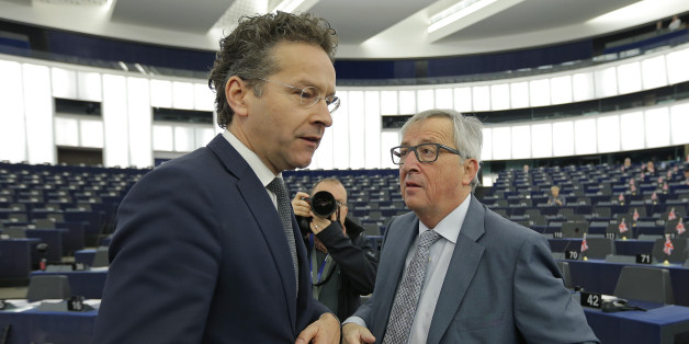 Commission President Jean-Claude Juncker (R) talks with Dutch Finance Minister and Eurogroup President Jeroen Dijsselbloem at the European Parliament in Strasbourg, France, ahead of a debate on the future of the Economic and Monetary Union, December 15, 2015. REUTERS/Vincent Kessler