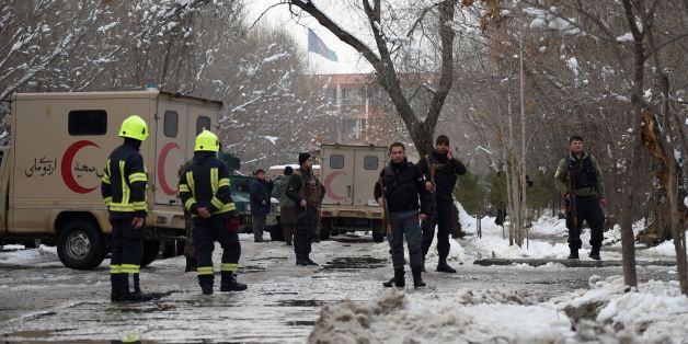 Afghan security personnel stand guard at the site of a suicide blast near the Afghan Supreme Court in Kabul on February 7, 2017.A suicide bomber on foot ripped through a crowd of Afghan Supreme Court employees on February 7, killing at least 20 people and wounding 41 others in the second attack on government institutions in under a month. / AFP / WAKIL KOHSAR (Photo credit should read WAKIL KOHSAR/AFP/Getty Images)