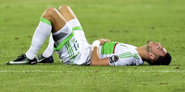 Algeria's defender Rami Bensebaini reacts at the end of the 2017 Africa Cup of Nations group B football match between Algeria and Tunisia in Franceville on January 19, 2017. / AFP / KHALED DESOUKI (Photo credit should read KHALED DESOUKI/AFP/Getty Images)