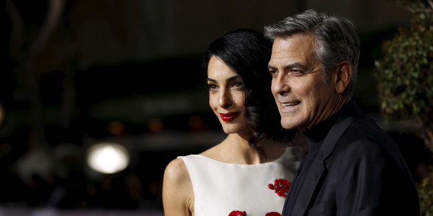 Cast member George Clooney and his wife Amal pose at the premiere of "Hail, Caesar!" in Los Angeles, California February 1, 2016. The movie opens in the U.S. on February 5. REUTERS/Mario Anzuoni