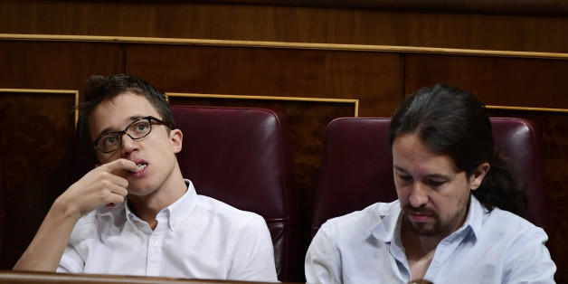 Leader of Podemos Pablo Iglesias (R) and Podemos' spokesman Inigo Errejon attend the second day of the parliamentary investiture debate to vote through a prime minister at the Spanish Congress (Las Cortes) on October 27, 2016, in Madrid.
As the conservatives prepare to re-take power in Spain after 10 months of political limbo, anti-austerity party Podemos is bent firmly on replacing the divided Socialists as the main opposition force.
/ AFP / GERARD JULIEN (Photo credit should read GERARD JULIEN/AFP/Getty Images)
