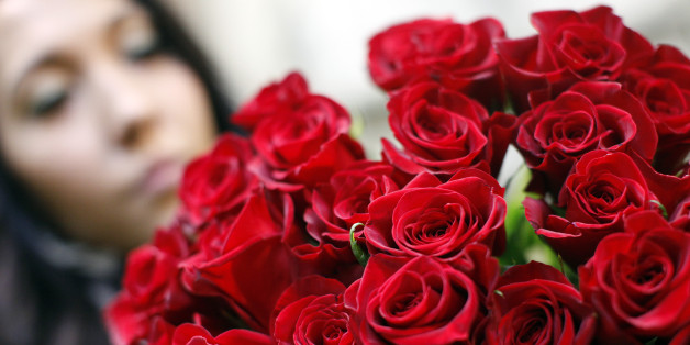 A florist sorts roses in a flower shop in Vienna February 13, 2013. On occasion of the Saint Valentine's Day on February 14 Austrians will spend some 21 million euros, and for the flower business it will be the top-selling day of the year, according to the Austrian Economic Chamber of Trade. REUTERS/Herwig Prammer (AUSTRIA - Tags: SOCIETY)