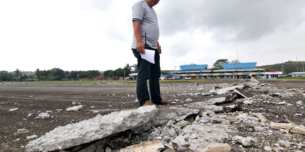 A man looks at the damaged runway of the dometic airport after a 6.5-magnitude earthquake struck overnight in Surigao City in southern island of Mindanao on February 11, 2017. A strong quake shook the southern Philippines on February 10, killing at least three people, toppling buildings and sending panicked residents fleeing their homes, media reports and authorities said. / AFP / ERWIN MASCARINAS (Photo credit should read ERWIN MASCARINAS/AFP/Getty Images)