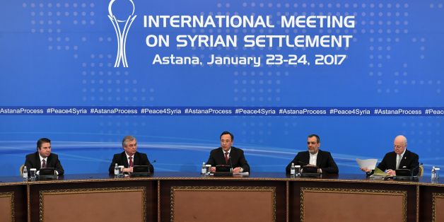 Kazakh Foreign Minister Kairat Abdrakhmanov (C) reads a final statement on Syria peace talks as UN envoy for Syria Staffan de Mistura (R) looks through his papers in Astana on January 24, 2017. / AFP / Kirill KUDRYAVTSEV (Photo credit should read KIRILL KUDRYAVTSEV/AFP/Getty Images)