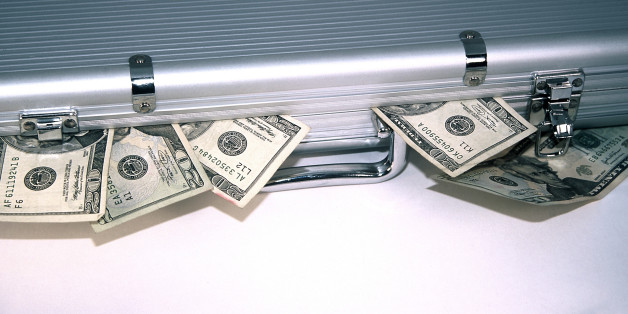 Sliver briefcase with money spilling out