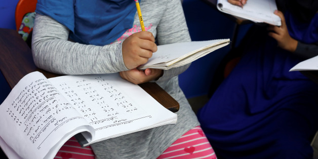 Young Muslim girls practice writing the Arabic language during lessons at Masjid Al-Salaam, a mosque and Islamic community center in Dearborn, Michigan, U.S., on November 13, 2016. REUTERS/Brittany Greeson
