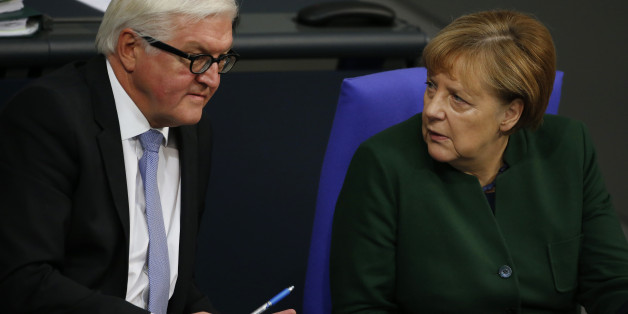 German Foreign Minister Frank-Walter Steinmeier and Chancellor Angela Merkel attend a meeting at the lower house of parliament Bundestag on 2017 budget in Berlin, Germany, November 23, 2016. REUTERS/Fabrizio Bensch
