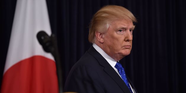 US President Donald Trump listen as Japanese Prime Minister Shinzo Abe (out of frame) speaks at Trump's Mar-a-Lago resort in Palm Beach, Florida, on February 11, 2017, after North Korea reportedly fired a ballistic missile, the first since Donald Trump became US president. / AFP / Nicholas Kamm (Photo credit should read NICHOLAS KAMM/AFP/Getty Images)