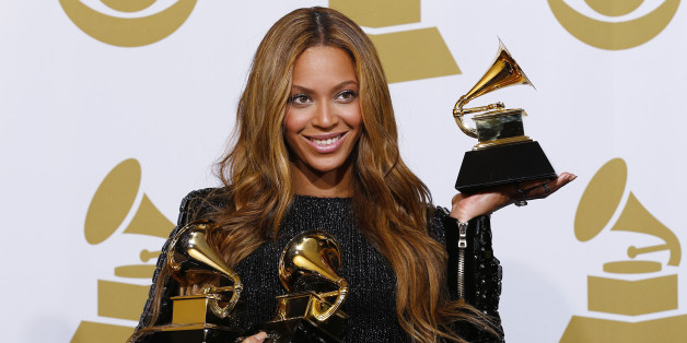 Beyonce holds the awards she won for Best R&B Performance and Best R&B Song for "Drunk in Love" and Best Surround Sound Album for "Beyonce" in the press room at the 57th annual Grammy Awards in Los Angeles, California February 8, 2015. REUTERS/Mike Blake (UNITED STATES - TAGS: ENTERTAINMENT) (GRAMMYS-BACKSTAGE)