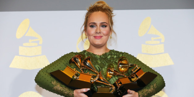 Adele holds the five Grammys she won including Record of the Year for "Hello" and Album of the Year for "25" during the 59th Annual Grammy Awards in Los Angeles, California, U.S. , February 12, 2017. REUTERS/Mike Blake