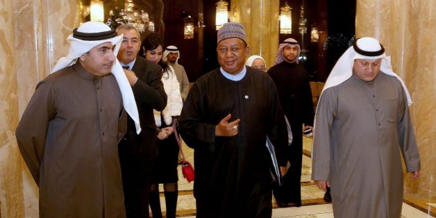 OPEC secretary general Mohammad Sanusi Barkindo (C) arrives to hold a joint press conference with the Kuwaiti oil minister (not seen) in Kuwait City on January 9, 2017. / AFP / Yasser Al-Zayyat (Photo credit should read YASSER AL-ZAYYAT/AFP/Getty Images)