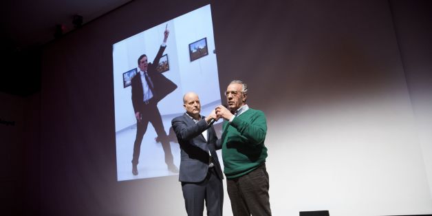 Winner of the World Press Photo 2016 photographer Burhan Ozbilici (R) and Managing Director of the World Press Photo Foundation Lars Boering, speak on stage during the announcement of the World Press Photo prizes in Amsterdam, on February 13, 2017.Brandishing a gun, his face contorted with rage, the shocking image of a Turkish policeman assassinating the Russian envoy to Turkey won the prestigious World Press Photo Award on February 13, 2017. / AFP / ANP / JEROEN JUMELET / Netherlands OUT