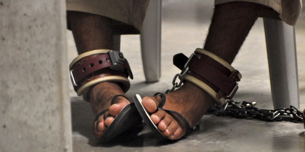 In this photo, reviewed by a U.S. Department of Defense official, a Guantanamo detainee's feet are shackled to the floor as he attends a "Life Skills" class inside the Camp 6 high-security detention facility at Guantanamo Bay U.S. Naval Base in this file pool photo taken April 27, 2010. Nearly two-thirds of Americans believe torture can be justified to extract information from suspected terrorists, according to a Reuters/Ipsos poll, a level of support similar to that seen in countries like Niger