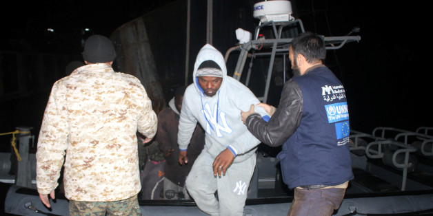 A migrant disembarks from a boat after he was arrested by Libyan coastguards in Tripoli, Libya February 5, 2017. REUTERS/Hani Amara