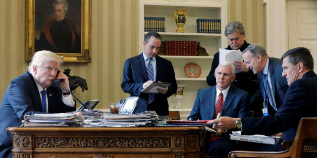 U.S. President Donald Trump (L-R), joined by Chief of Staff Reince Priebus, Vice President Mike Pence, senior advisor Steve Bannon, Communications Director Sean Spicer and National Security Advisor Michael Flynn, speaks by phone with Russia's President Vladimir Putin in the Oval Office at the White House in Washington, U.S. January 28, 2017. REUTERS/Jonathan Ernst