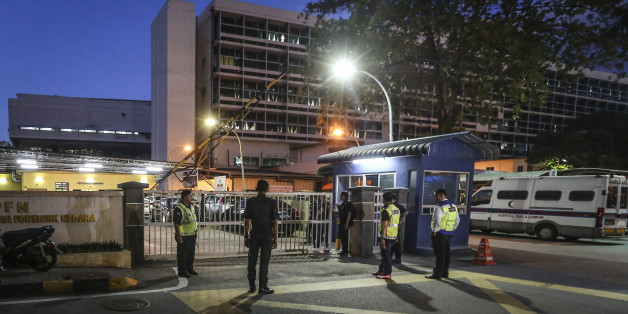 Police officers guard the entrance of the forensic department of Kuala Lumpur General Hospital, where the body Jong-nam half-brother of North Korean leader Kim Jong-Un, on February 15, 2017. (Photo by Mohd Daud/NurPhoto via Getty Images)