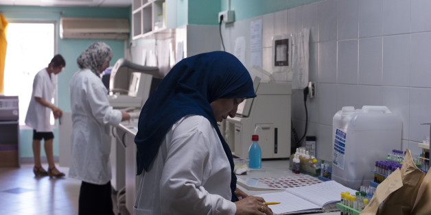 Doctors and technicians complete medical tests at a private clinic in Algiers, Algeria. (Photo by Monique Jaques/Corbis via Getty Images)