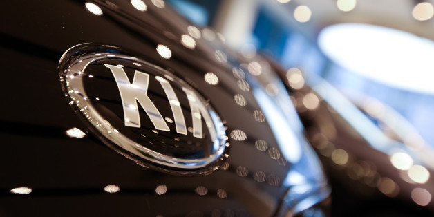 The Kia Motors Corp. logo is displayed on a vehicle in the lobby of the company's headquarters in Seoul, South Korea, on Monday, Jan. 23, 2017. Kia is scheduled to report full-year results on Jan. 25. Photographer: SeongJoon Cho/Bloomberg via Getty Images