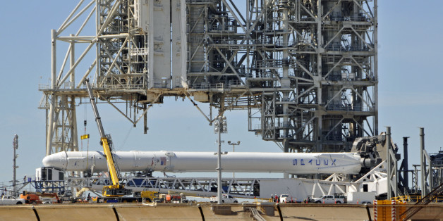 Space X's Falcon 9 rocket is prepared for a launch to the International Space Station February 17, 2017 at the Kennedy Space Center, Florida on LC39A, one of the renovated Space Shuttle launch pads that SpaceX leases from NASA. The Falcon 9 with a Dragon spacecraft is scheduled to be launched February 18. / AFP / BRUCE WEAVER (Photo credit should read BRUCE WEAVER/AFP/Getty Images)