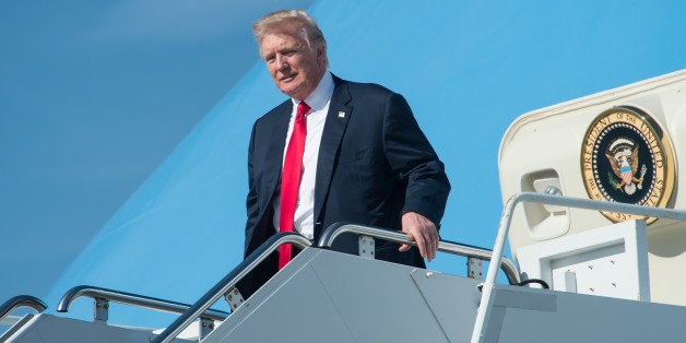 US President Donald Trump arrives at Palm Beach International Airport in Florida to spend the weekend at his Mar-a-Lago resort on February 17, 2017. / AFP / NICHOLAS KAMM (Photo credit should read NICHOLAS KAMM/AFP/Getty Images)