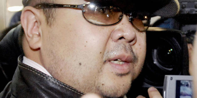 Beijing, CHINA: A man believed to be North Korean leader Kim Jong-Il's eldest son, Kim Jong-Nam, is surrounded by journalists upon his arrival at Beijing's capital airport, 11 February 2007. Wearing a cap, sunglasses and jeans, the man who Japanese television crew described as Kim Jong-Nam arrived at Beijing's airport from Macau in the afternoon, as six-nation talks on ending North Korea's nuclear weapons programme were underway in the Chinese capital. Kim Jong-Nam, 35, was recently reported to have been living the high life in Macau, a southern China casino haven, for most of the past three years. JAPAN OUT AFP PHOTO / JAPAN POOL via JIJI PRESS (Photo credit should read AFP/AFP/Getty Images)