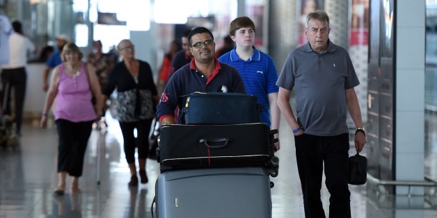 Tourists arrive at the Enfidha International airport on July 10, 2015. Denmark followed Britain's example in urging its nationals to cut short their holidays in Tunisia after London warned the country was still unsafe after last month's beach massacre. AFP PHOTO / FETHI BELAID (Photo credit should read FETHI BELAID/AFP/Getty Images)