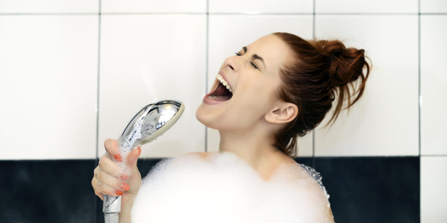 woman singing at shower hard.
