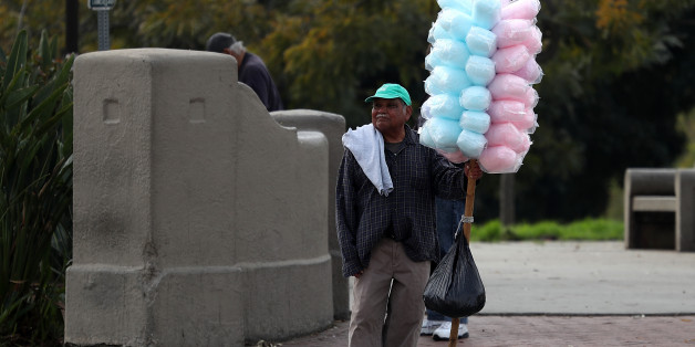 LOS ANGELES, CA - FEBRUARY 16: A street vendor carries cotton candy on February 16, 2017 in Los Angeles, California. The Los Angeles City Council unanimously voted Wednesday to decriminalize street vending in an effort to reduce chances of illegal immigrants being deported for criminal convictions. (Photo by Justin Sullivan/Getty Images)