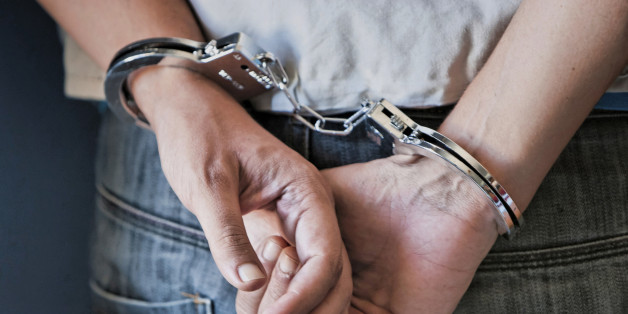 Young man in handcuffs