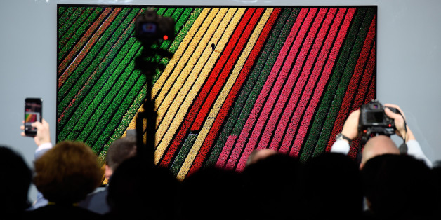 LAS VEGAS, NV - JANUARY 04: Members of the media photograph the LG Signature OLED TV W during a LG press event for CES 2017 at the Mandalay Bay Convention Center on January 4, 2017 in Las Vegas, Nevada. CES, the world's largest annual consumer technology trade show, runs from January 5-8 and is expected to feature 3,800 exhibitors showing off their latest products and services to more than 165,000 attendees. (Photo by David Becker/Getty Images)
