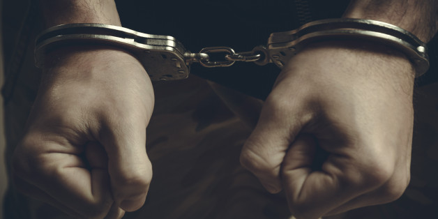 Male hands in handcuffs