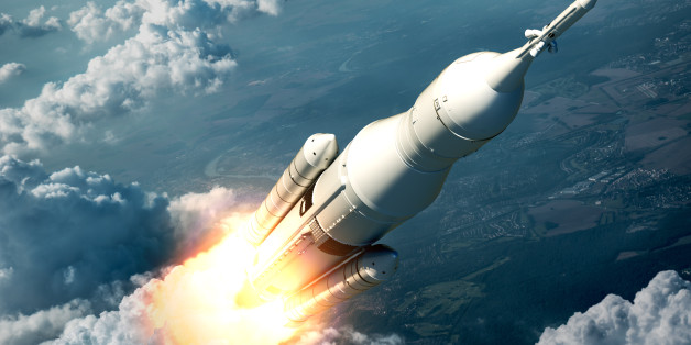 Space Launch System Flying Over The Clouds. 3D Scene.