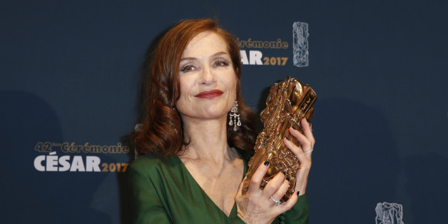 Actress Isabelle Huppert holds her trophy during a photocall after receiving the Best Actress Award for her role in the film "Elle" at the 42nd Cesar Awards ceremony in Paris, France, February 24, 2017. REUTERS/Gonzalo Fuentes