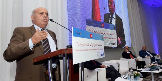 Tunisian Minister of Public Service and Governance, Abid Briki (L), speaks during the opening of the National Conference to Combat Corruption, on December 8, 2016, in Tunis. / AFP / FETHI BELAID (Photo credit should read FETHI BELAID/AFP/Getty Images)