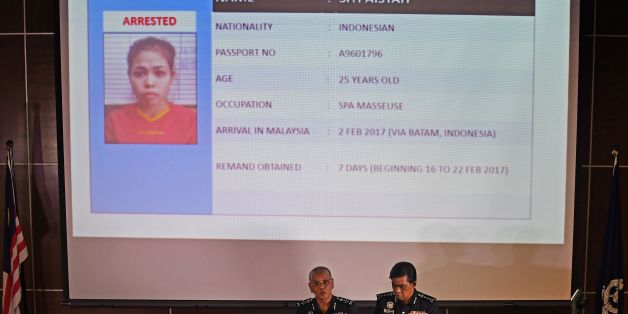 Royal Malaysian Police deputy inspector-general Noor Rashid Ibrahim (centre L) speaks about detained Indonesian suspect Siti Aisyah (top) during a press conference as Selangor state police chief Abdul Samah Mat (R) looks on, at the Bukit Aman national police headquarters in Kuala Lumpur on February 19, 2017, following the February 13 assassination of Kim Jong-Nam, the half brother of North Korean leader Kim Jong-Un.Malaysian police said on February 19 they were seeking four more North Korean sus