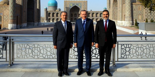 SAMARKAND, UZBEKISTAN - NOVEMBER 18: President of Turkey, Recep Tayyip Erdogan (C), Head Of National Intelligence Organization of Turkey Hakan Fidan (R) and Chief of the General Staff of the Turkish Armed Forces Hulusi Akar (L) pose for a photo as they visit the tomb of Abu Mansur Al Maturidi also know as Imam Maturidi in Samarkand, Uzbekistan on November 18, 2016. Bukhari is a Persian Islamic scholar who was educated in Islamic theology, Qur'anic exegesis, and Islamic jurisprudence and was born in Samarkand and died on 944 A.D.. (Photo by Kayhan Ozer/Anadolu Agency/Getty Images)