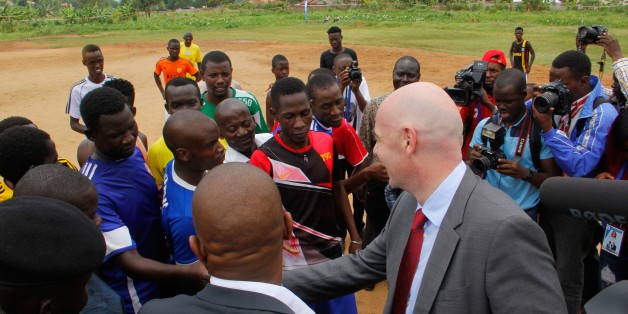 KAMPALA, UGANDA - FEBRUARY 25: FIFA President Gianni Infantino speaks with young footballers during his visit in Kampala, Uganda on February 25, 2017. (Photo by Lubowa Abubaker/Anadolu Agency/Getty Images)