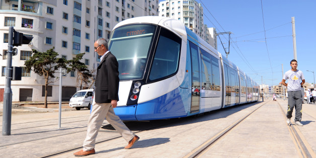 Men walk along the tracks of Algiers new tramway system which opened on May 8, 2011. After a two-year delay, the new tramway service opened, starting with a 7.2 km section running between Bordj El Kiffan and Bab-Ezzouar, serving residents in the densely populated eastern part of the city. AFP PHOTO / FAROUK BATICHE (Photo credit should read FAROUK BATICHE/AFP/Getty Images)