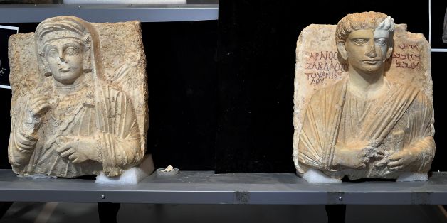 A picture taken on February 16, 2017 shows two funeral reliefs from Palmyra archeological site that will be restored, at the Higher Institute of Conservation and Restoration (ISCR - Istituto Superiore per la Conservazione ed il Restauro), in Rome.The busts of a man and a woman, dated from the 2nd and 3rd century AD and destroyed by the Islamic State group (IS), have been entrusted to the care of the technical and restorers of the ISCR in Rome. By the end of this month, they will be returned to t