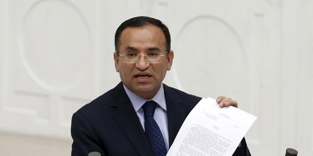 Justice Minister Bekir Bozdag addresses the Turkish Parliament during a debate in Ankara in this March 19, 2014 file photo. Turkey will work on new rules to strip citizenship from Turks found to be supporting terrorism, Bozdag said on Wednesday, a day after President Tayyip Erdogan called for the measure. REUTERS/Umit Bektas/Files