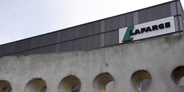 A picture shows the logo on a plant of French cement company Lafarge on April 7, 2014 in Paris. Swiss cement group Holcim and French rival Lafarge are merging to create the biggest global concrete group worth 40.0 billion euros, with an eye to booming construction in emerging markets, the new group LafargeHolcim announced on April 7. The deal, a major event in the global construction industry described in a joint statement as 'a merger of equals', will be based on the offer of one Holcim share f