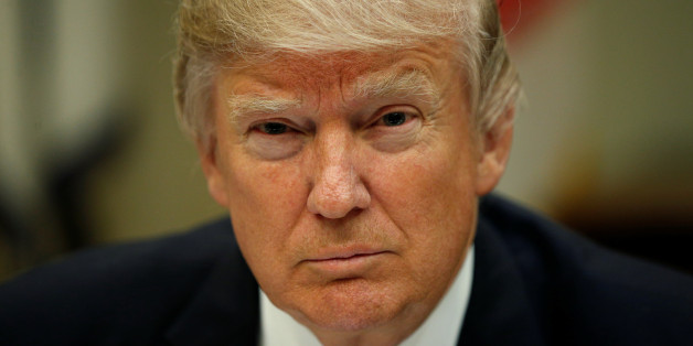 U.S. President Donald Trump looks up while hosting a House and Senate leadership lunch at the White House in Washington, U.S. March 1, 2017. REUTERS/Kevin Lamarque