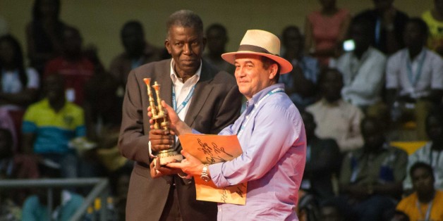 OUAGADOUGOU, BURKINA FASO - MARCH 05: Algerian film director Lotfi Bouchouchi (R) holds the award after receiving the during the award ceremony on the last day of 25th Panafrican FESPACO Film and Television Festival at Dr Issoufou Joseph Conombo Stadium in capital Ouagadougou, Burkina Faso on March 05, 2017. (Photo by Olympia de Maismont/Anadolu Agency/Getty Images)