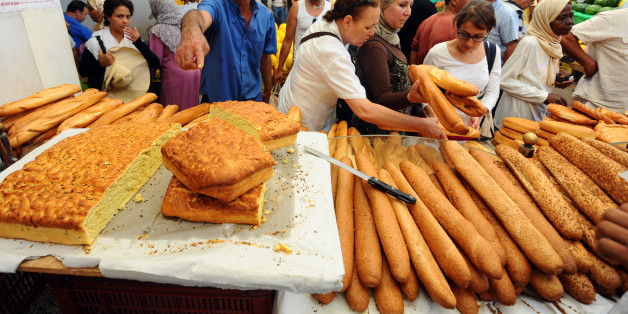 Tunisian people queue to buy bread at the central market in Tunis on July 20, 2012 as people make preparations for the Islamic holy month of Ramadan. Muslims across the world are preparing to observe the holy month of Ramadan, abstaining from consuming food and drink from dawn to dusk.
AFP PHOTO / FETHI BELAID (Photo credit should read FETHI BELAID/AFP/GettyImages)