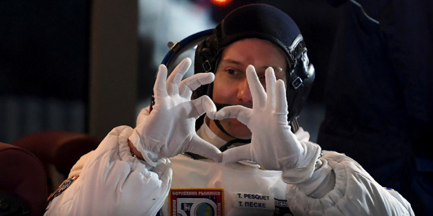 The International Space Station (ISS) crew member Thomas Pesquet of France gestures as he sits in a bus before boarding spacecraft at the Baikonur cosmodrome, Kazakhstan 17 November 2016. REUTERS/Kirill Kudryavtsev/ Pool