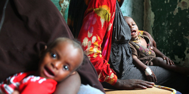 SOMALIA - AUGUST 2: (SOUTH AFRICA OUT) Somalian parents with their sick children at the Gift of Givers make-shift hospital August 2, 2011 in Somalia. South African based disaster relief organisation 'Gift of the Givers' is on a relief mission to provide medical assistance and food aid to the desperate famine stricken people of Somalia. (Photo by The Times/Gallo Images/Getty images)